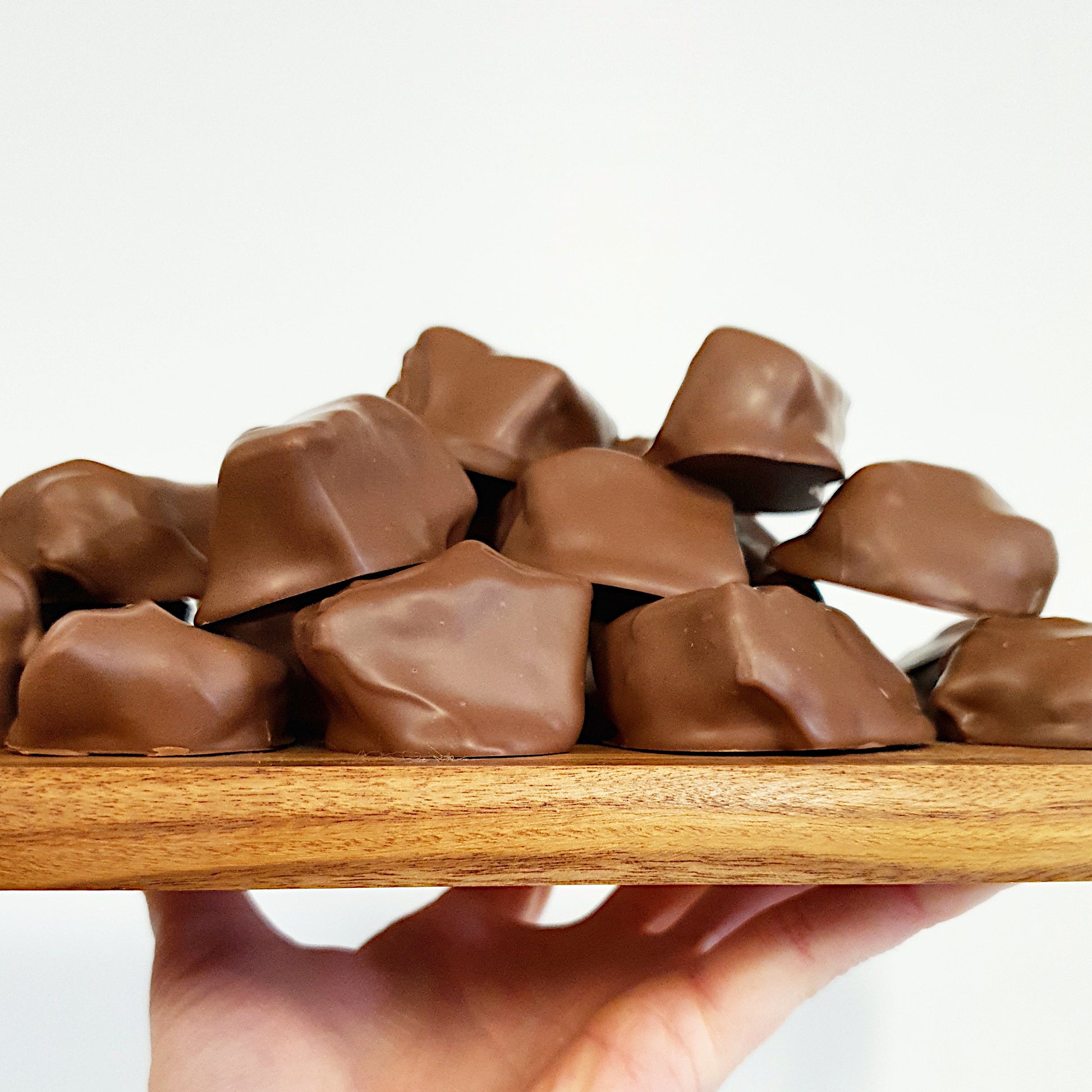 Handmade honeycomb pieces made with local Pointer Mountain honey at Woodstock Chocolate Co at Milton on the New South Wales South coast. Made using Callebaut Belgian couverture chocolate. Available in milk and dark