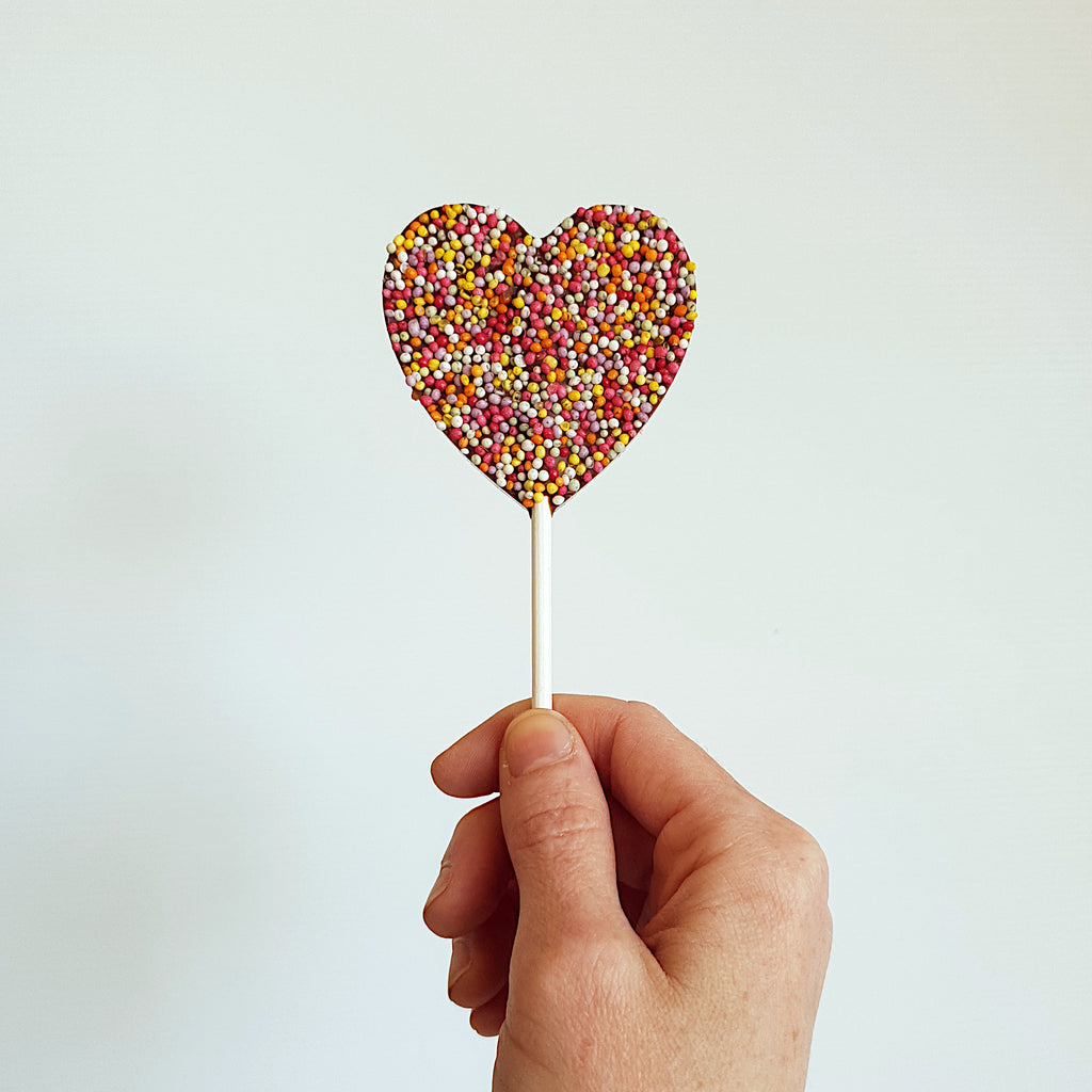 Belgian milk chocolate lollipop topped with nonpareils. Available in heart and round shape. Handmade by Woodstock chocolate co in Milton, on the south coast of New South Wales.