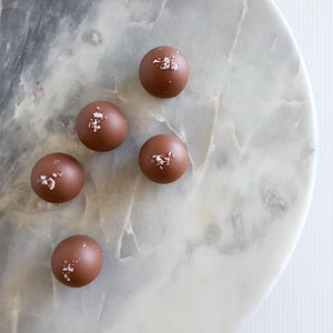 Salted caramel truffles. Handmade chocolate truffles filled with rich salted caramel ganache and enrobed in Callebaut Belgian couverture milk chocolate. Made by Woodstock chocolate co in Milton on the south coast of NSW