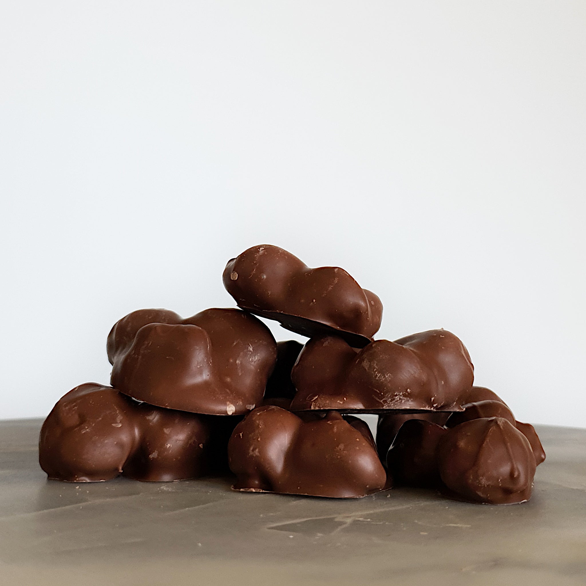Caramelised macadamia nuts coated in Belgian milk chocolate handmade on the south coast of NSW