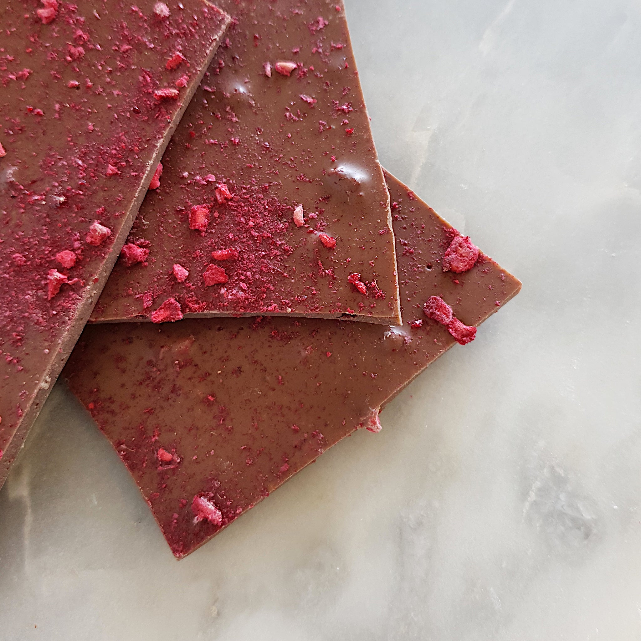Milk chocolate raspberry bark made using Callebaut Belgian couverture chocolate. Handmade in Milton NSW by local chocolate shop Woodstock Chocolate Co. 