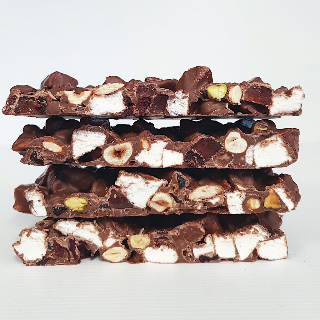 Milk chocolate rocky road containing vanilla marshmallow, Turkish delight pieces, caramelised almond, pistachio and hazelnut, dried cranberries. Handmade in Milton at Woodstock Chocolate Co.